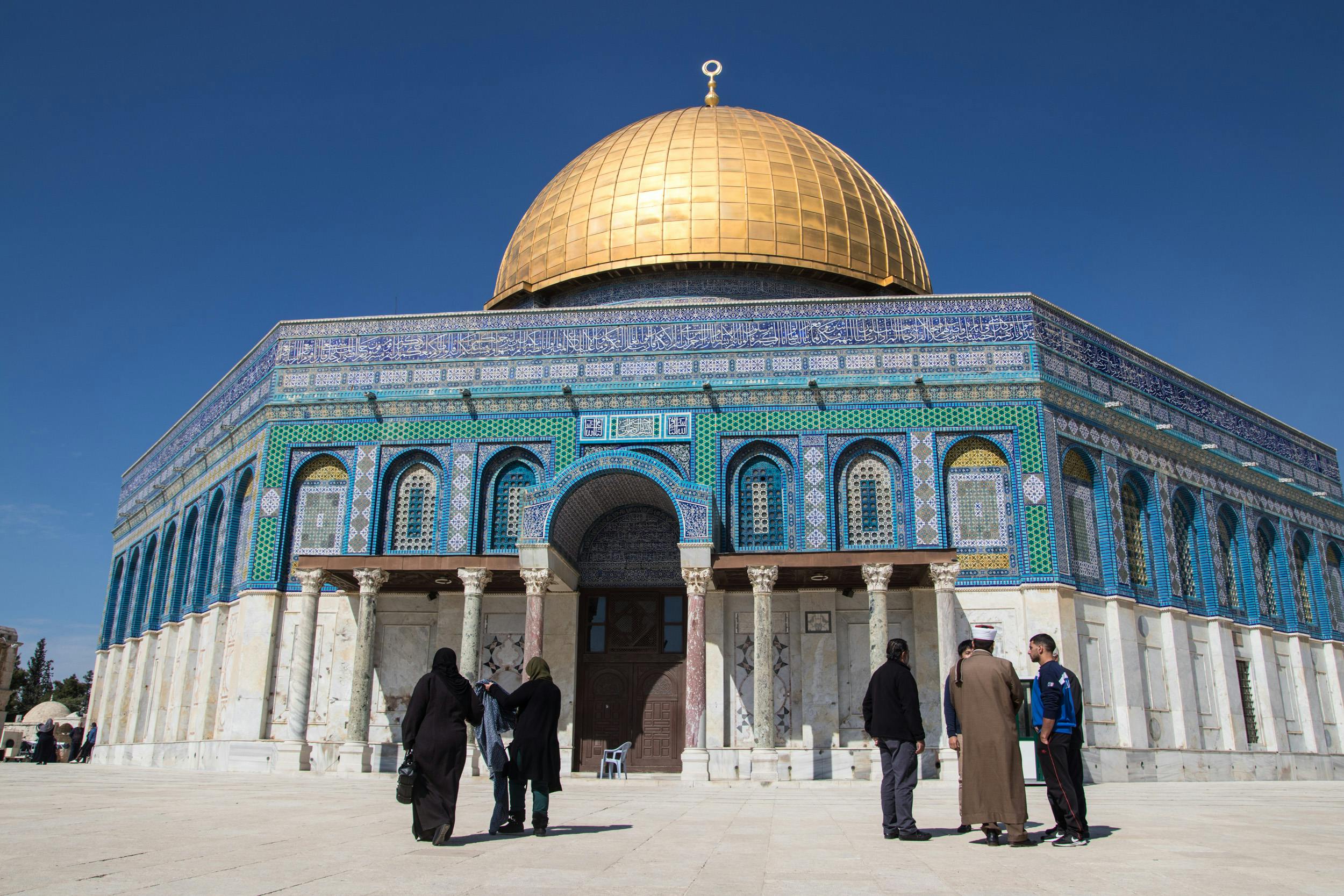 Home Iconic Dome of the Rock with golden dome in Jerusalem, showcasing Islamic architecture under a clear blue sky.